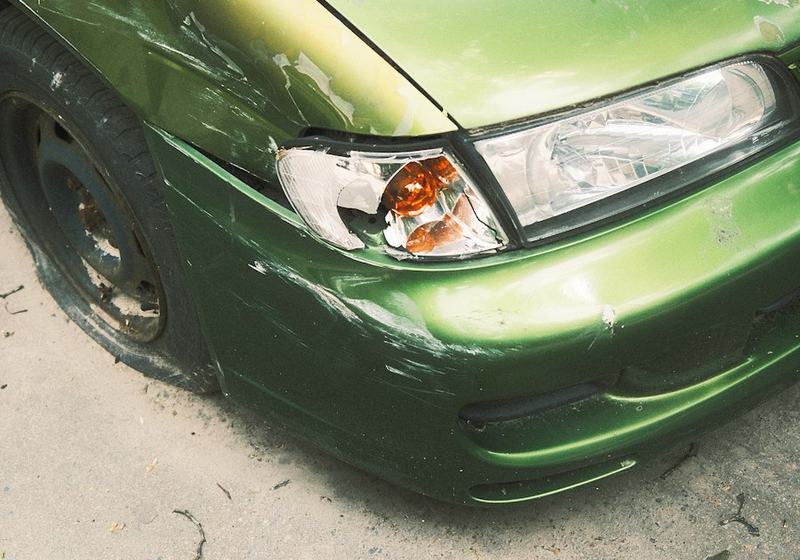 Car with a dented front bumper